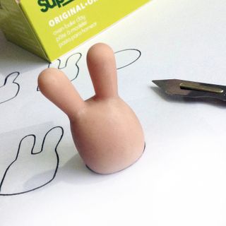 Super Sculpey clay is used to make a master for the art toy
