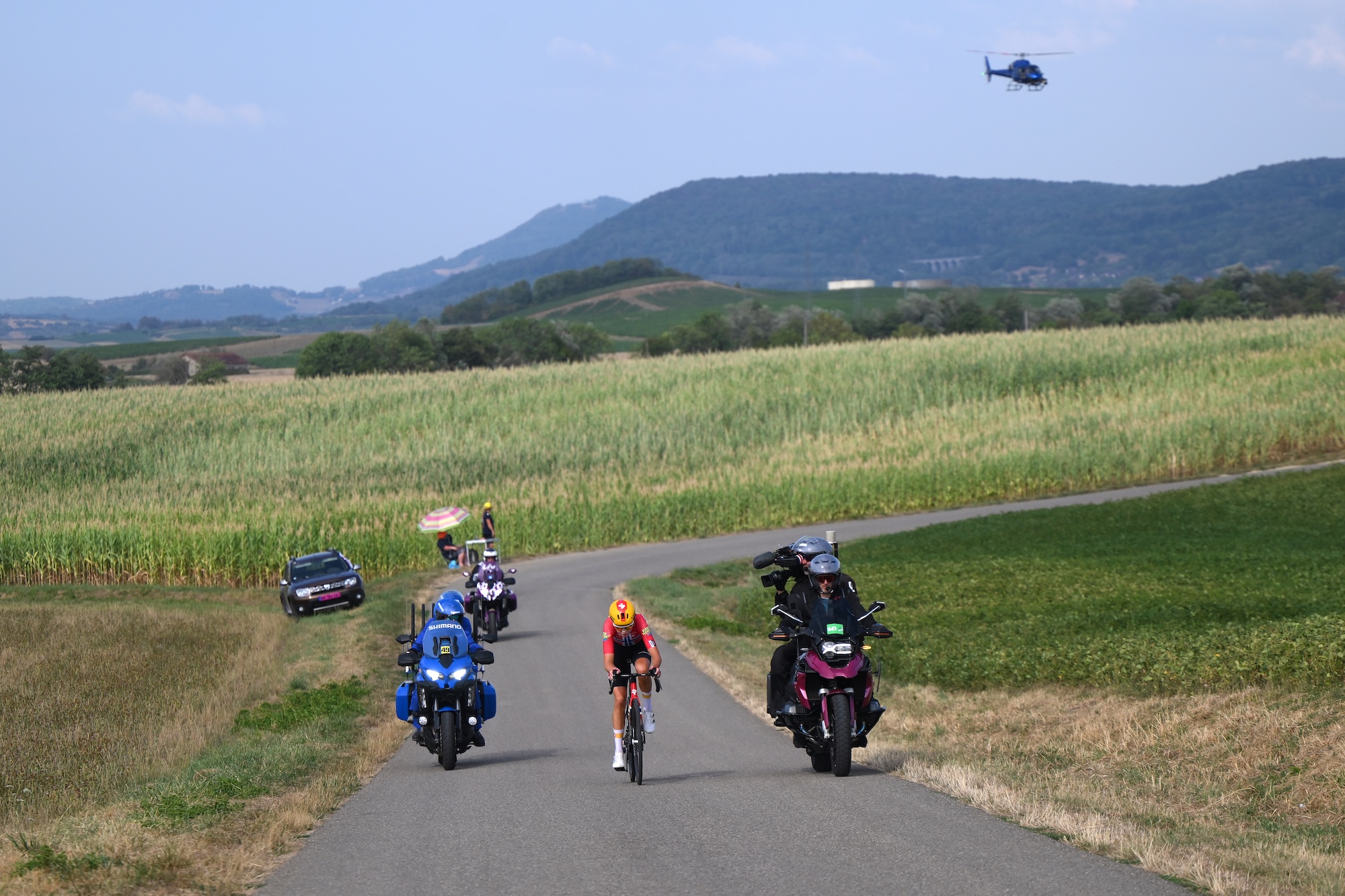 Stage 3 winner Sigrid Haugset of Uno-X Mobility competes in the solo breakaway from Geneva to Poligny