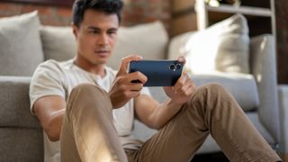 oneplus nord n20 announcement image of phone in models hand while gaming