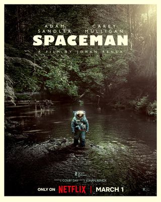 an astronaut in a bulky spacesuit stands in a stream in a forest
