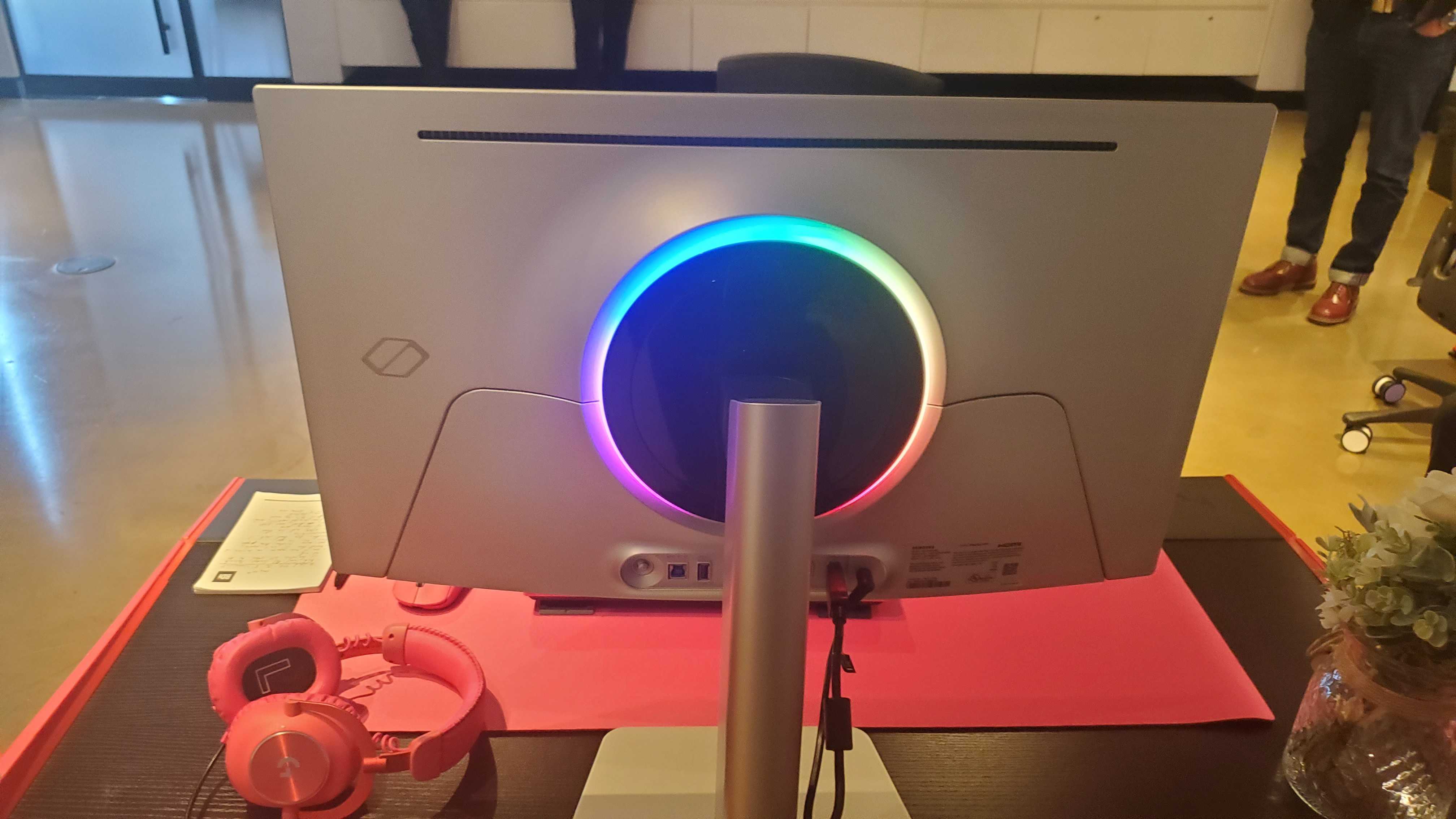 gaming monitor near pink keyboard