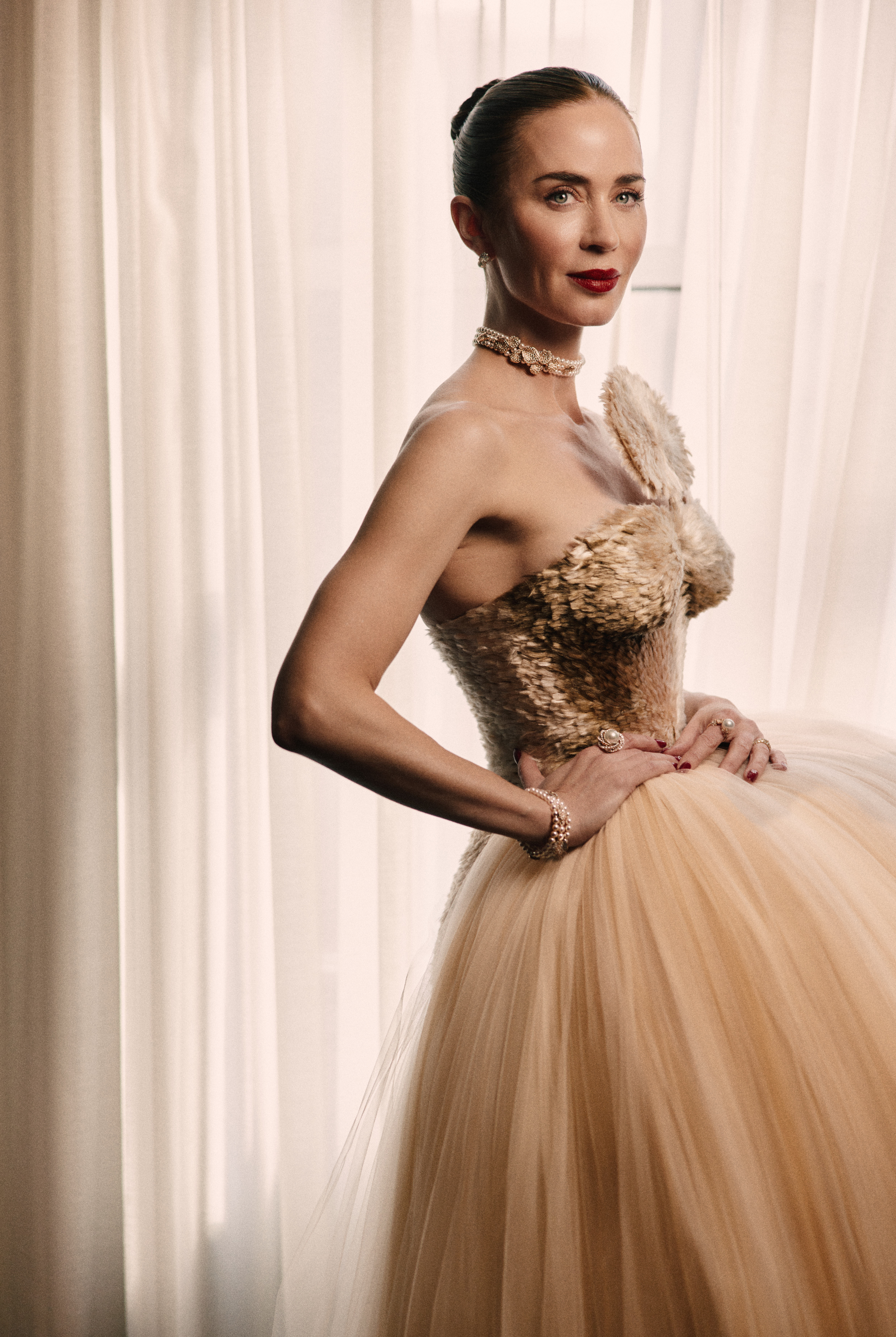 Emily Blunt wearing Schiaparelli and Mikimoto pearls