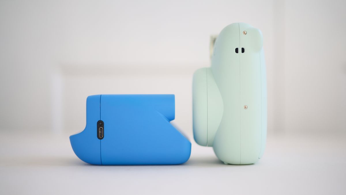 Polaroid Go Gen 2 side-by-side size comparison with an Instax Mini 12, against a white background