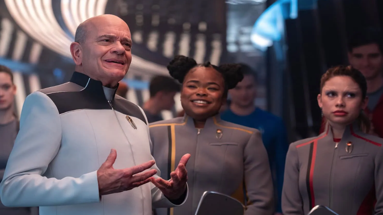 A male sci-fi character with two female cadets