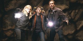 National Treasure: Book Of Secrets Diane Kruger, Justin Bartha, and Nicolas Cage navigate a cave wit