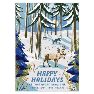 Christmas card with outdoor woodland snow scene with reindeer and happy holidays message
