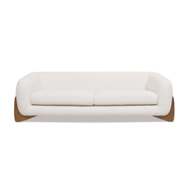white boucle sofa with wooden legs