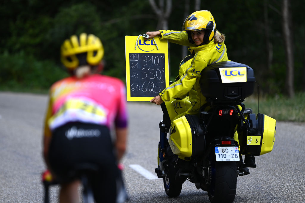 LE MARKSTEIN FRANCE JULY 30 LCL Time Chrono Motorbike Ardoisier shows the timings to Demi Vollering of Netherlands and Team SD Worx whilst she competes in the chase during the 1st Tour de France Femmes 2022 Stage 7 a 1271km stage from Slestat to Le Marksteinc TDFF UCIWWT on July 30 2022 in Le Markstein France Photo by Tim de WaeleGetty Images