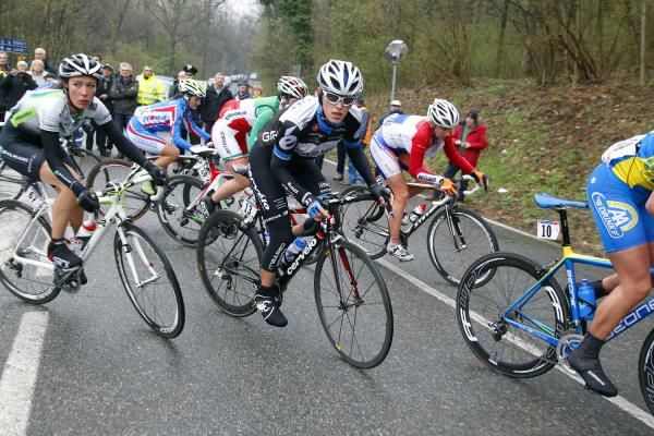 The peloton takes a corner very carefully