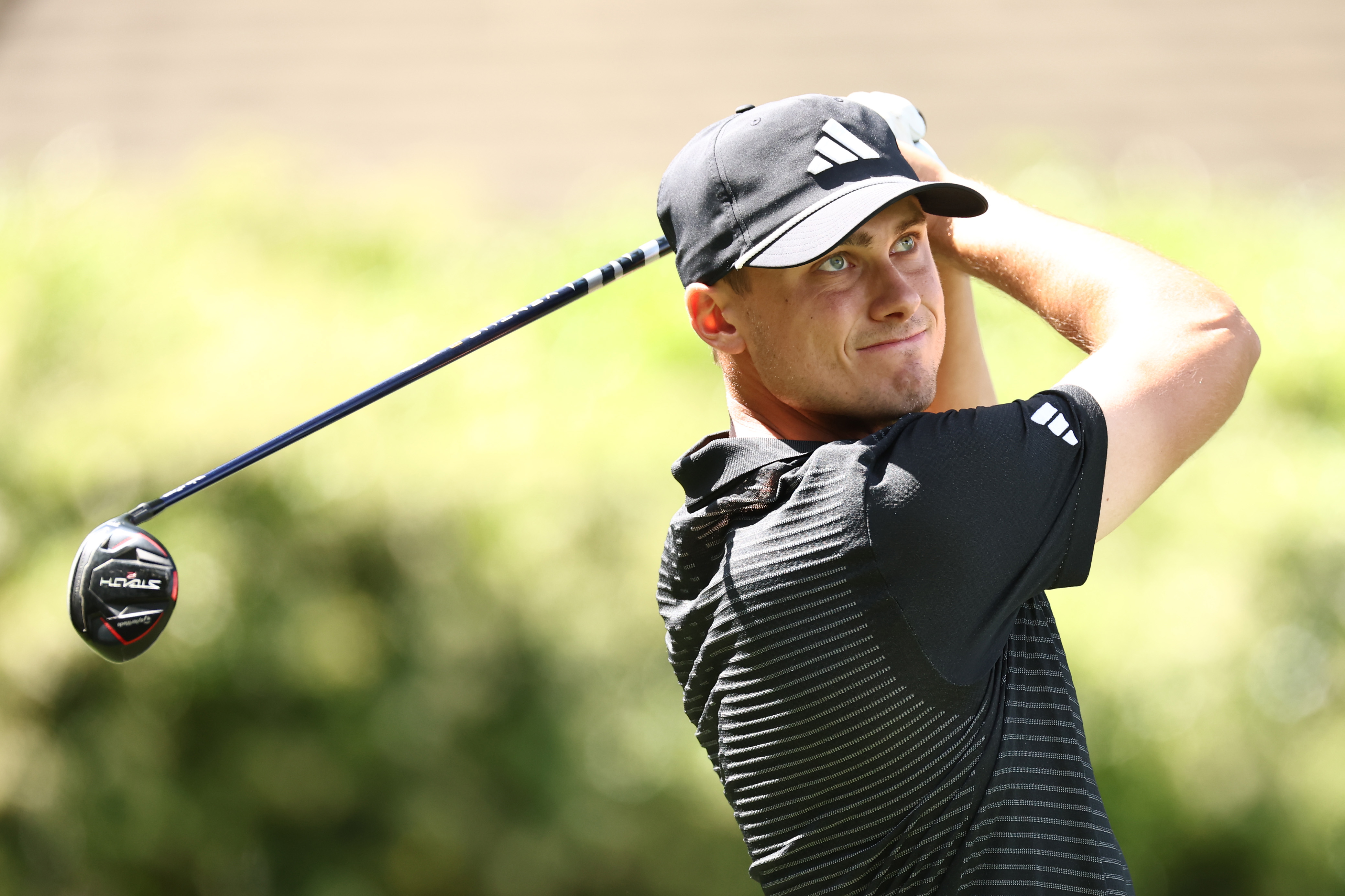 Ludvig Aberg hits a fairway wood off the tee