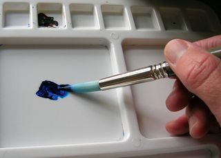 Work a generous amount of paint into the tip of your brush