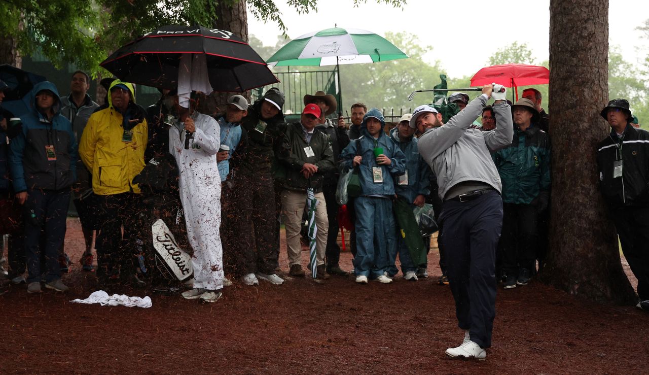 Cameron Young strikes a shot from the pine straw at Augusta National