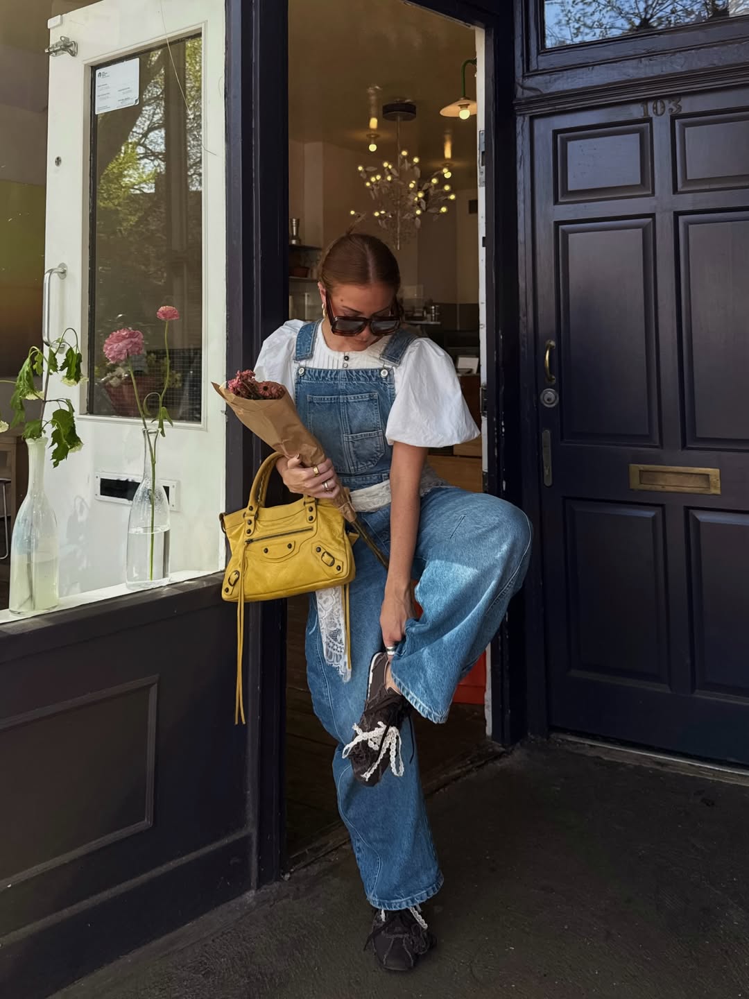 Influencer Rebecca Ferraz Wyatt wearing dungarees.