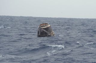 SpaceX's first Dragon capsule to visit the International Space Station bobs in the Pacific Ocean after a successful splashdown that capped its successful test flight on May 31, 2012.