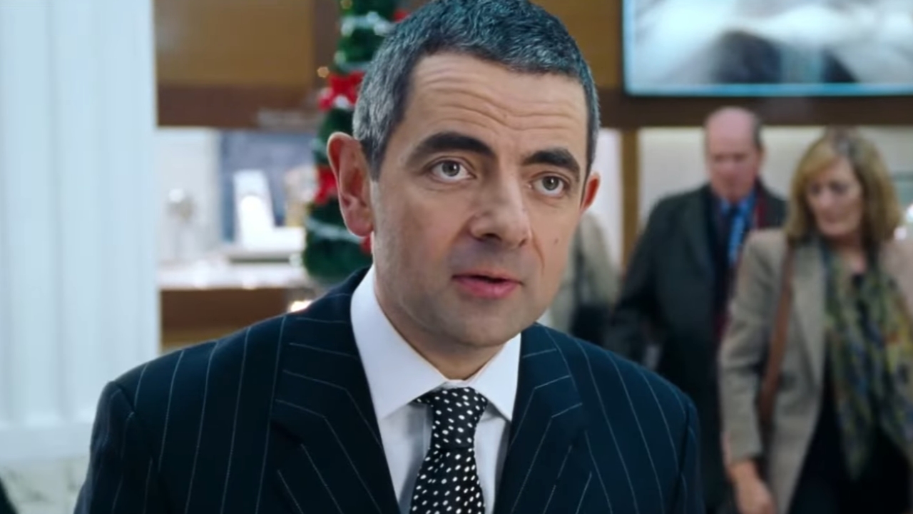 Rowan Atkinson wrapping a Christmas gift in Love Actually