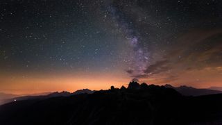 Low Angle View Of Mountains Against Star Field - stock photo