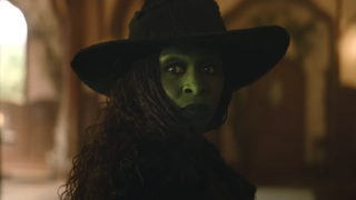 Cynthia Erivo as Elphaba looking back while wearing witch hat in Wicked For Good