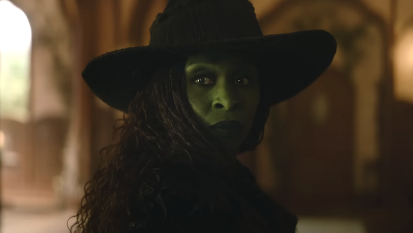Cynthia Erivo as Elphaba looking back while wearing witch hat in Wicked For Good