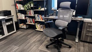 Flexispot C7 in a smart home office, desk and bookcase behind the chair