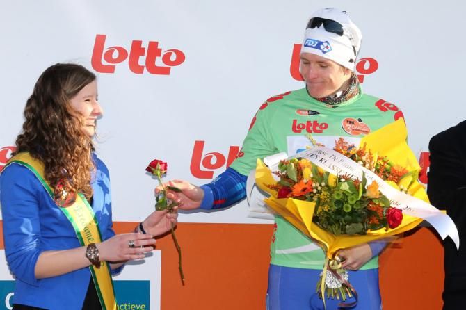 Points leader Arnaud Demare (FDJ) offers a rose to the podium hostess.