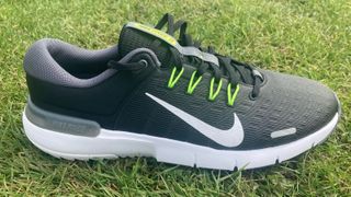 The Nike Free Golf NN Shoes on a green background
