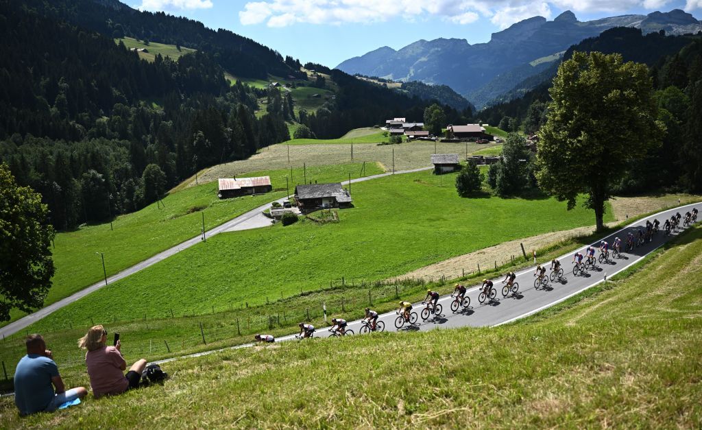 The pack of riders cycles in the Swiss Alps during the 9th stage of the 109th edition of the of the Tour de France cycling race 1929 km between Aigle in Switzerland and Chatel Les Portes du Soleil in the French Alps on July 10 2022 Photo by AnneChristine POUJOULAT AFP Photo by ANNECHRISTINE POUJOULATAFP via Getty Images