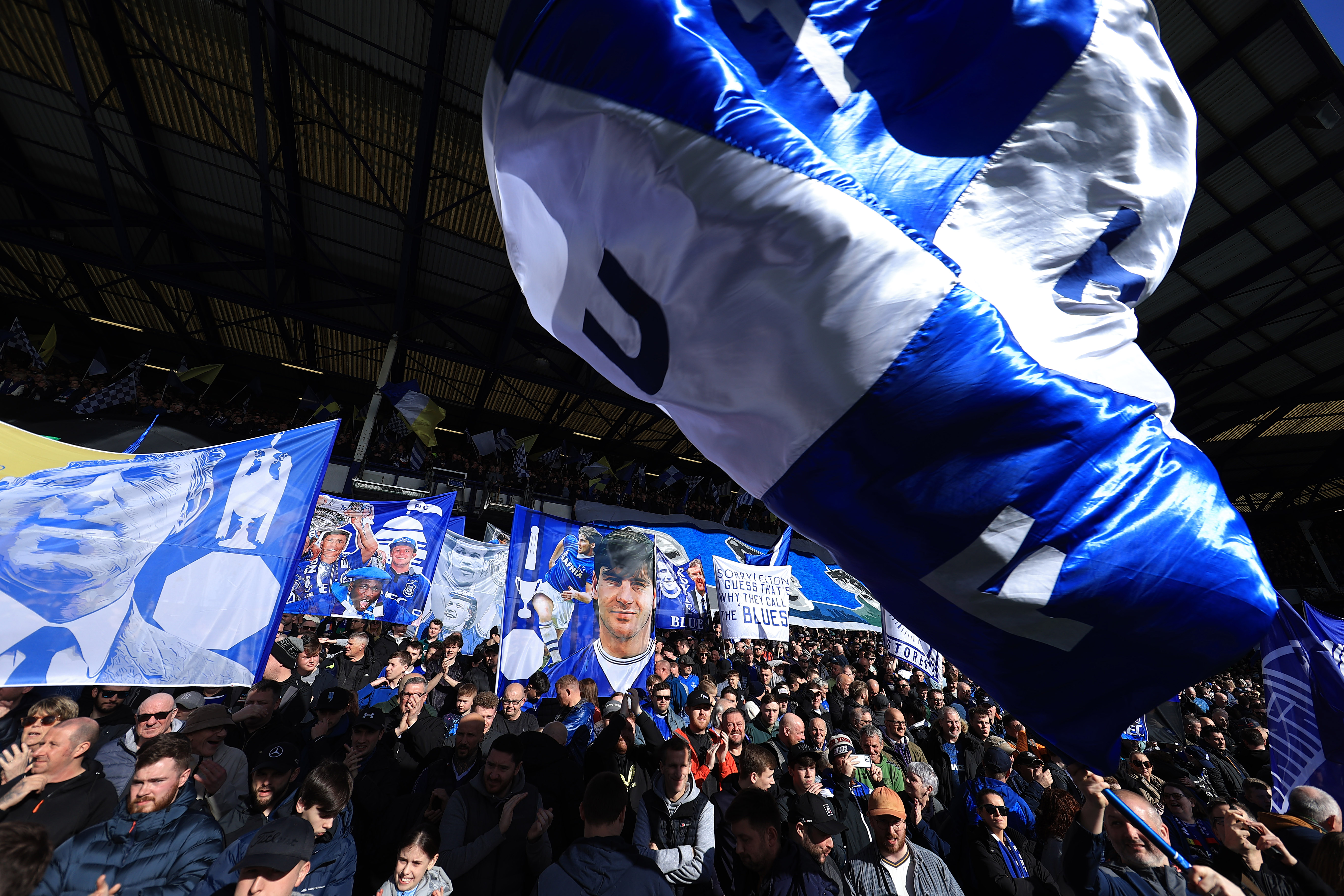 Everton fans waving flags at Goodison Park