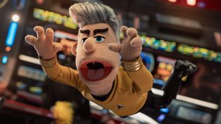 Puppet Pike dives for the console. 