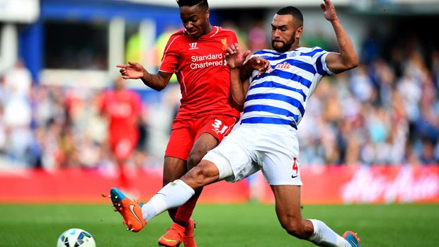 Raheem Sterling and Steven Caulker battle for ball