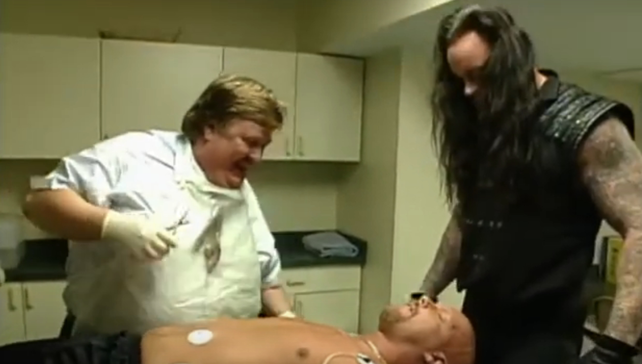 Paul Bearer and Undertaker preparing to embalm Stone Cold Steve Austin