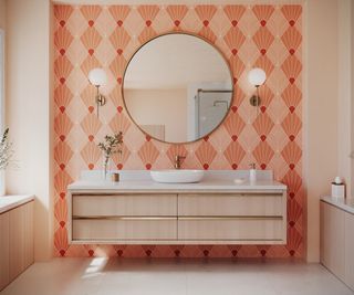 peach and orange patterned wallpaper behind wallmounted double pale wooden vanity unit