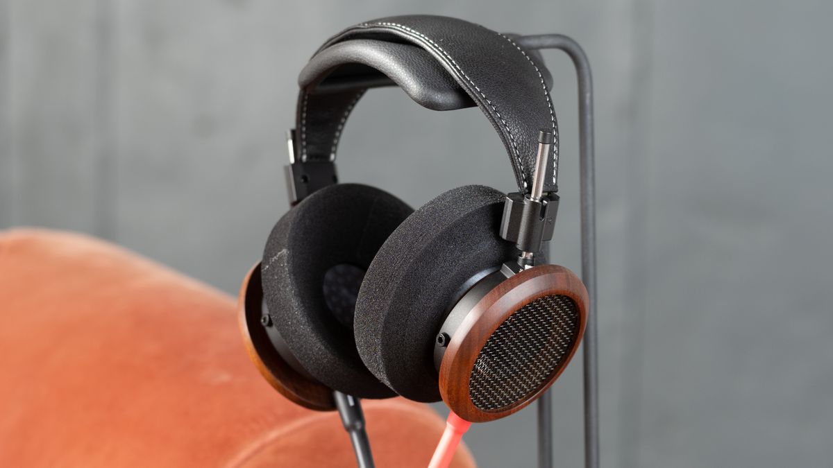 Grado Signature S950 headphones hanging on a headphones holder, in a gray room