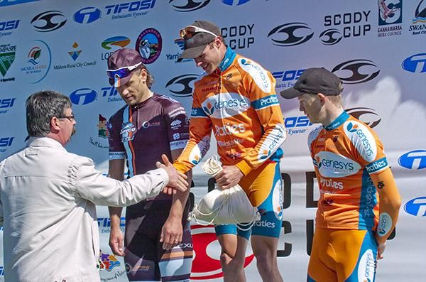 Stage winner Steele Von Hoff (Genesys Wealth Advisers) is presented with his Sunraysia oranges and runner-up Ben Kersten (Swan Hill Heart of the Murray), and Patrick Shaw (3rd,Genesys Wealth Advisers) look on.