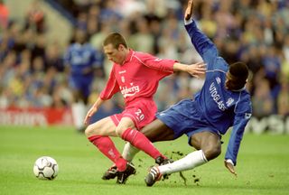 Liverpool's Nick barmby holds off Chelsea's Marcel Desailly at Stamford Bridge in 2000.
