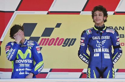 JEREZ, SPAIN - APRIL 10:Race winner Valentino Rossi of Italy and Yamaha stands on the podium beside a disappointed 2nd placed Sete Gibernau (L) of Spain and Honda and 3rd placed Marco Melandr