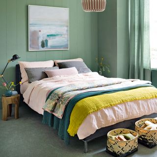 green themed bedroom with carpet flooring and wall painting