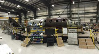 Work on SpaceShipTwo Serial 2, the second spaceship, is underway within The Spaceship Company's hangar.