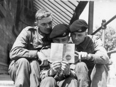 Left to right Sapper D Bottell, Sapper L T Penfold and Sapper H D Shaw study the highway code at Aldershot barracks