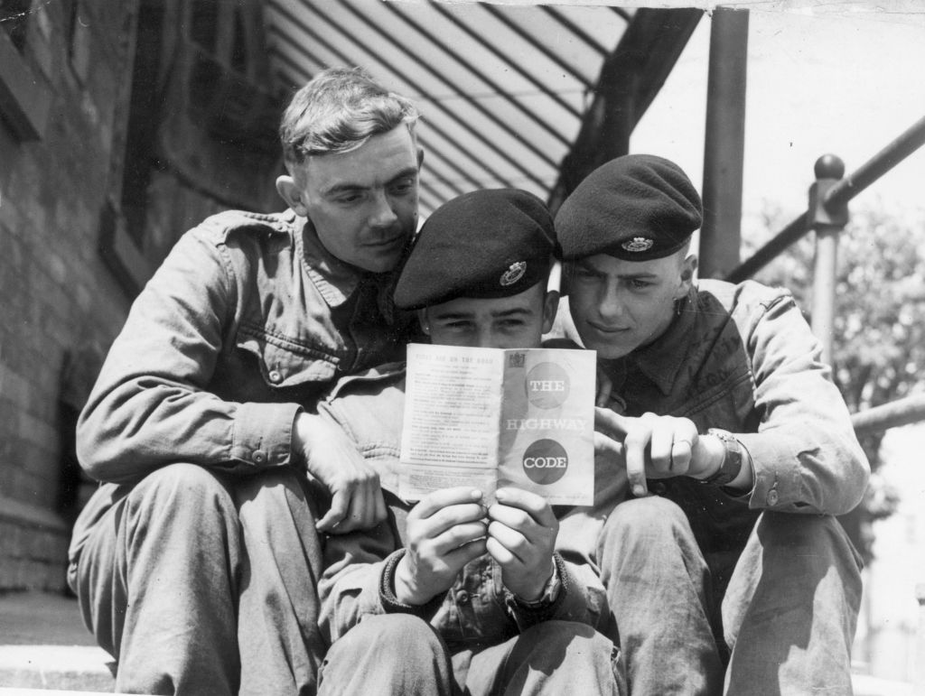 Left to right Sapper D Bottell, Sapper L T Penfold and Sapper H D Shaw study the highway code at Aldershot barracks 