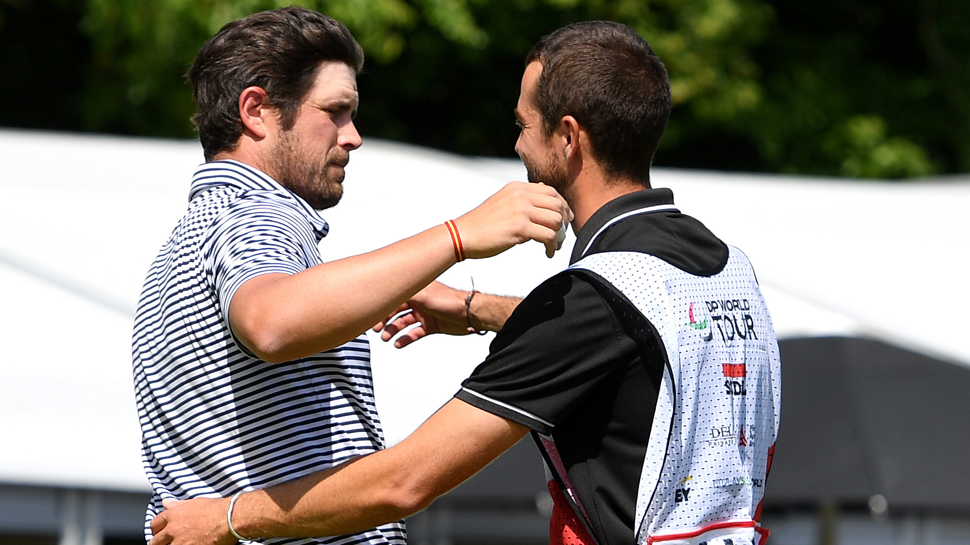 Nacho Elvira and his caddie celebrate victory in the Soudal Open