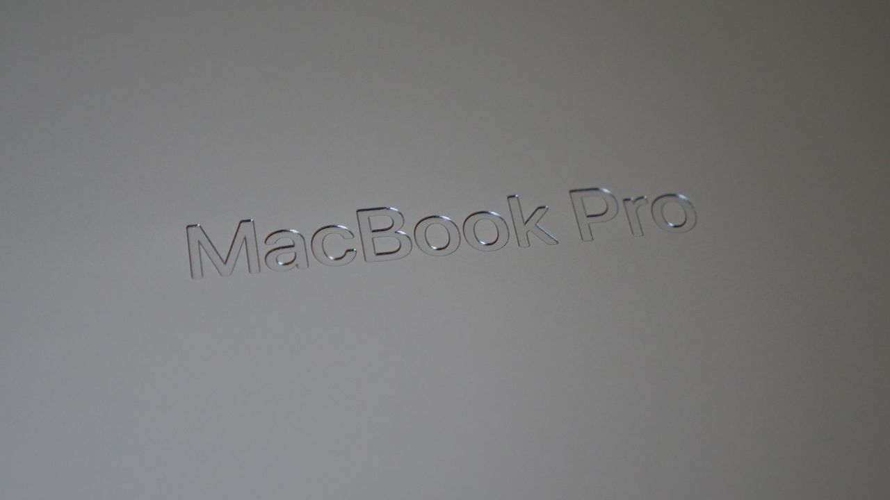 Apple MacBook Pro 16-inch M4 Pro 2024 on a wooden desk