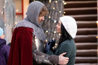 Vanessa Hudgens wears a cream beret and gazes up at a knight in 'The Knight Before Christmas'