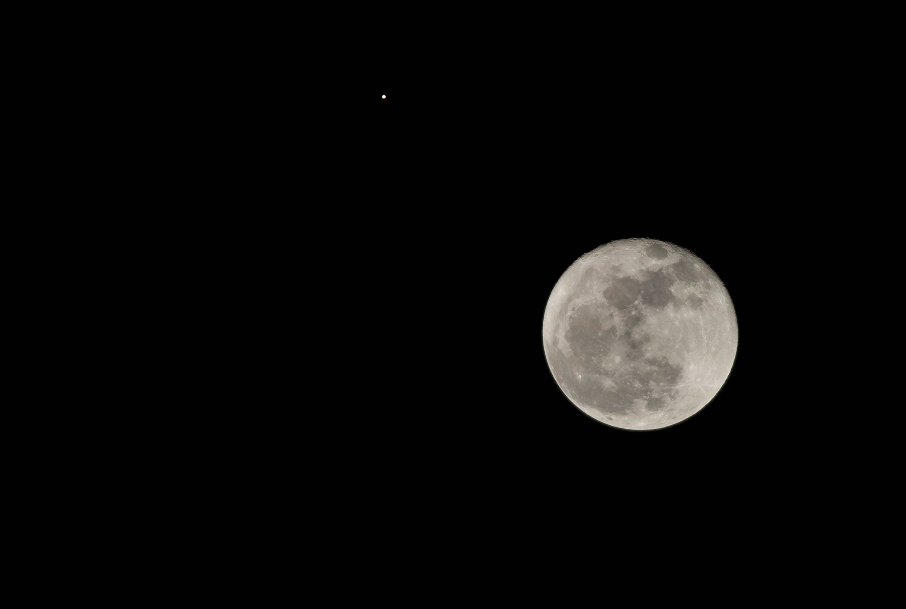 View of the moon alongside planet Mars, as seen from Bogota City on October 02, 2020.