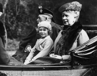 Princess Elizabeth with her grandparents King George V and Queen in a carriage