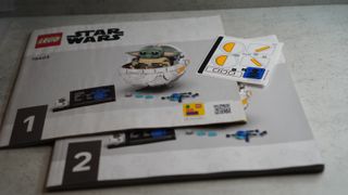 Lego Star Wars Grogu with Hover Pram instruction booklets and sticker sheet.