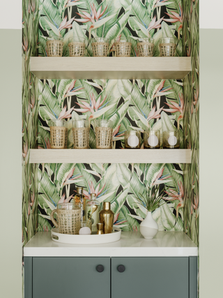 A corner bar with floating shelves and a wallpaper