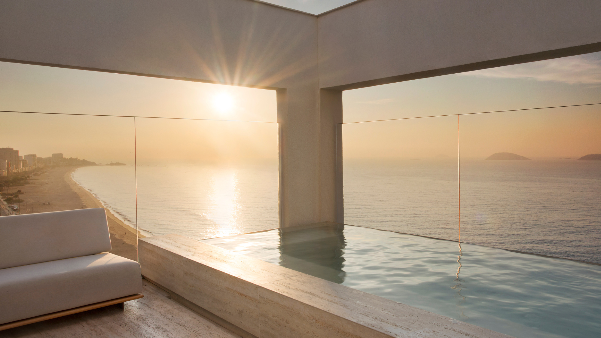 Janeiro Hotel rooftop pool at sunset