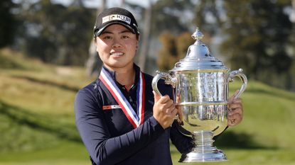 Yuka Saso holds the US Women's Open trophy after victory in 2021