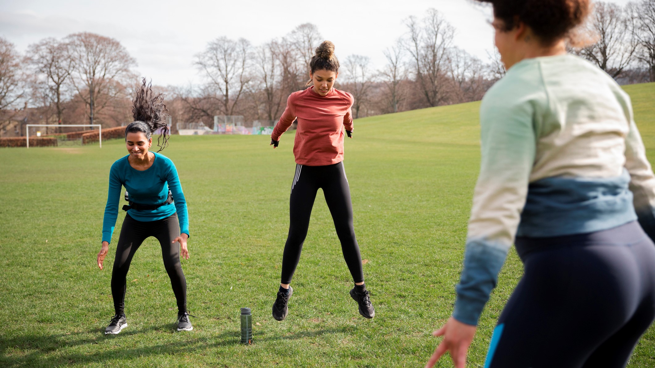 a photo of a woman doing a burpee