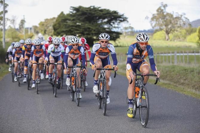 Joe Cooper (Huon-Genesys) drives the peloton.